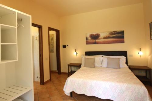 Postel nebo postele na pokoji v ubytování Agriturismo Peretti