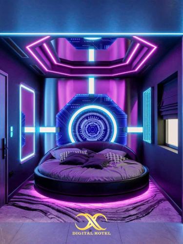 a room with a bed with a blue and purple lighting at X-Digital HOTEL in Bắc Ninh