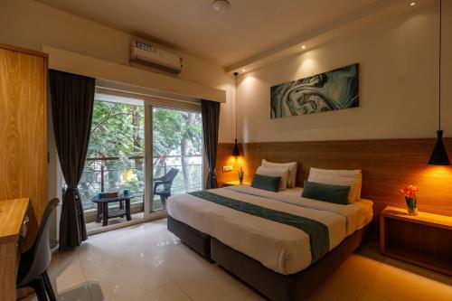 Ένα ή περισσότερα κρεβάτια σε δωμάτιο στο Eiffel Suites - Kammanahalli
