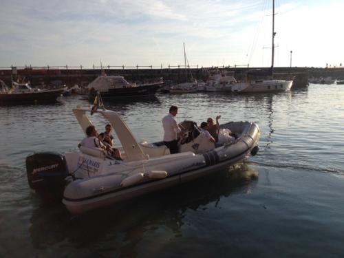 a group of people riding on a raft in the water at Stella Maris Resort in Camogli