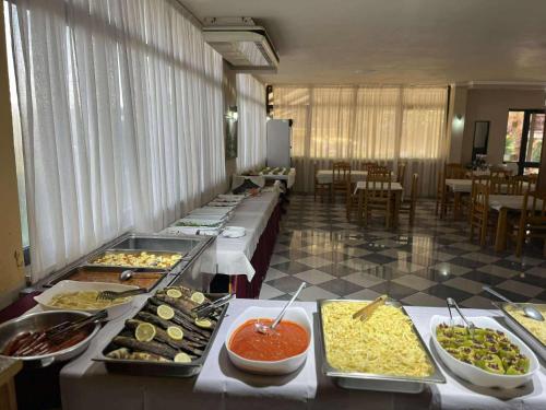 a buffet line with many different types of food at Hotel Kupola in Spille