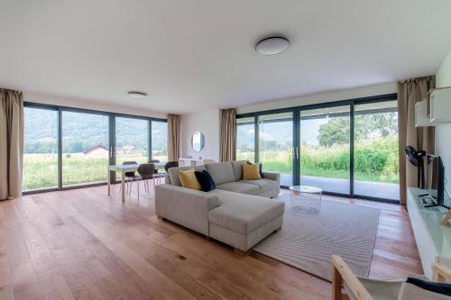 a living room with a couch and a table at Residenza Ticino by Quokka 360 - Modern Oasis near Bellinzona in Bellinzona
