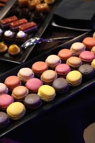 a bunch of different types of donuts on a tray at Radisson Blu GHR Rome in Rome