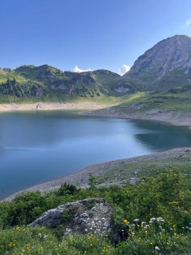 a large body of water with mountains in the background at Alexandra Alber Villa Schlosskopf in Sankt Anton am Arlberg