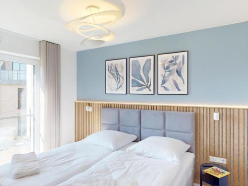 Una cama o camas en una habitación de Lighthouse Duhner Spitze - W07