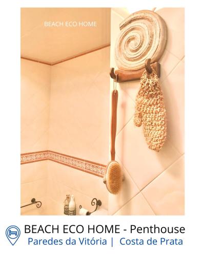 a bathroom with a shower with a scarf on the wall at BEACH ECO HOME Penthouse in Senhora da Vitória