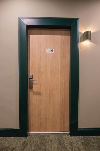 a wooden door with the number on it at Grand Juste in Marseille