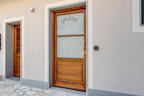 a wooden door on the side of a building at Il Borghetto Bed and Breakfast in Borgo San Lorenzo