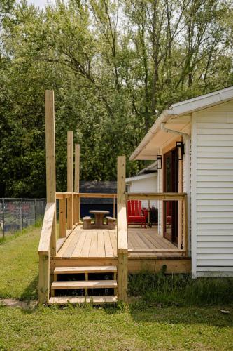 a large wooden deck next to a house at Kevins Place near PawPaw Lake in Watervliet