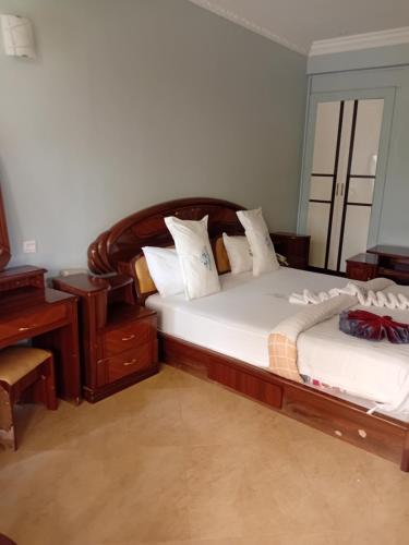 Katil atau katil-katil dalam bilik di Rising Sun Hotel