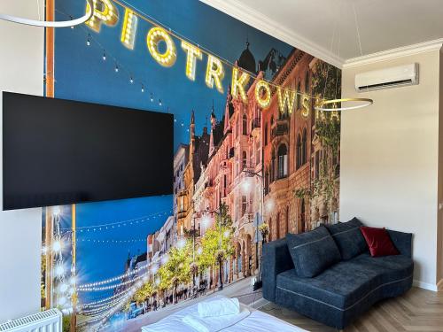 a living room with a wall mural of a building at NOWE !!! Apartamenty OFF PIOTRKOWSKA w Roosevelta Residence, Klimatyzacja, Wejście na KOD, WiFi, FV in Łódź