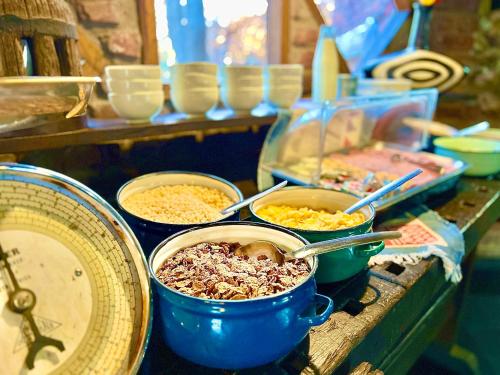 a buffet filled with bowls of food on a table at Roy's Rest Camp in Groutfontein