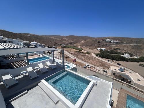 an aerial view of a swimming pool in a house at Merchia Bay Villas Mykonos in Merchia Beach