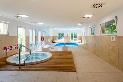 a bathroom with a jacuzzi tub in the middle at DIUNA Beskidy - Korbielów in Korbielów