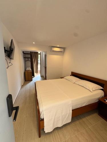 Postel nebo postele na pokoji v ubytování Hotel ENAD