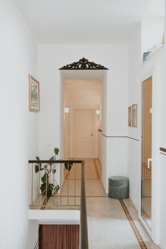 a hallway with a staircase in a house at Casa Qafiz 
