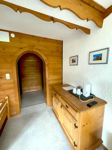 a room with a wooden cabin with a door at Hotel Wildrose in Neukirchen am Großvenediger