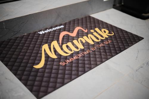 Marnik Suitesに飾ってある許可証、賞状、看板またはその他の書類