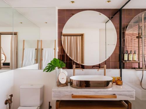 a bathroom with a sink and a mirror at ME Marbella by Meliá in Marbella