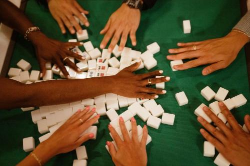 a group of people playing a game of dominoes at San Francisco Marriott Marquis Union Square in San Francisco
