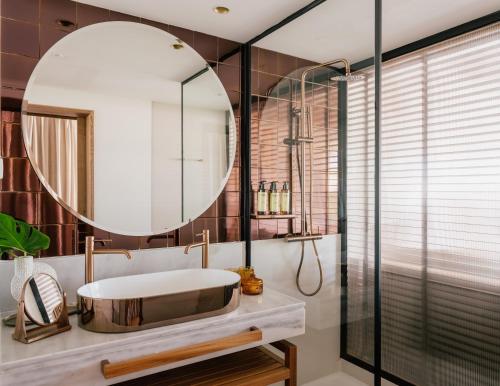 a bathroom with a sink and a mirror at ME Marbella by Meliá in Marbella