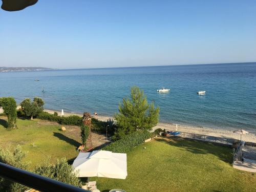 a view of the ocean from a balcony at Heavenly place in Possidi