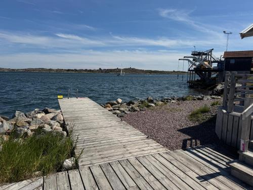 a wooden pathway leading to a large body of water at Villa Jan in Öckerö