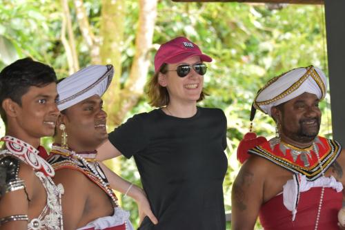 a woman standing between two women in traditional costumes at AHAS GAWWA Boutique in Padukka