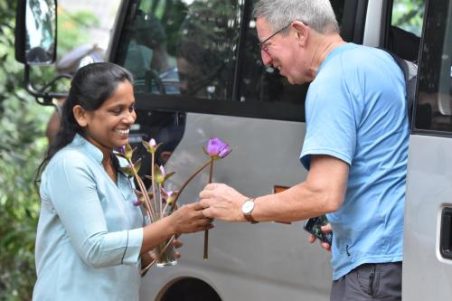 a man and woman shaking hands in front of a bus at AHAS GAWWA Boutique in Padukka