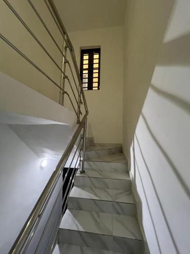 a staircase in a house with a window at Stunning and peaceful Home in Mama