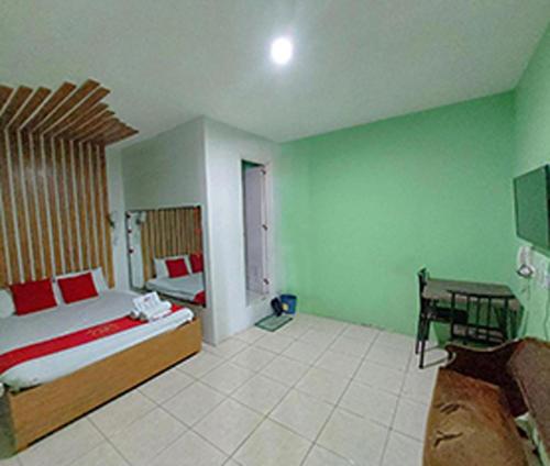 Ένα ή περισσότερα κρεβάτια σε δωμάτιο στο MCT Hotel