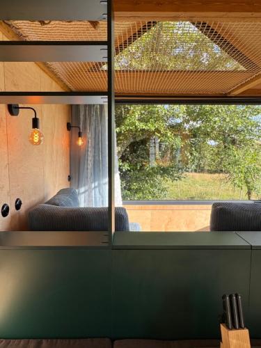 a view through a window in a bus at Tinyhouse in der Natur in Hahn bei Marienberg