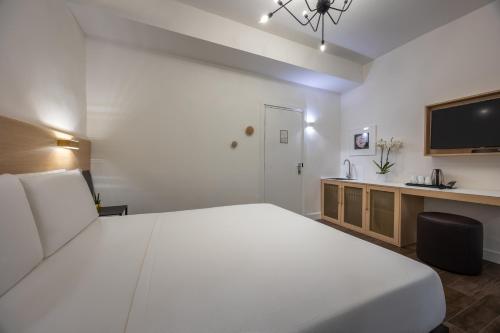 Postel nebo postele na pokoji v ubytování Globus Urban Hotel