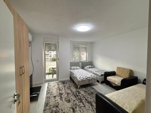 Katil atau katil-katil dalam bilik di Beho Apartaments