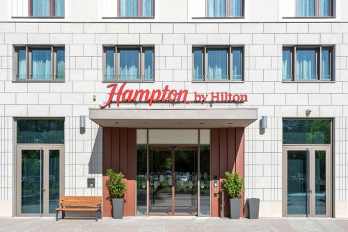 a building with a sign that reads hampton by hilton at Hampton By Hilton Dresden City Centre in Dresden