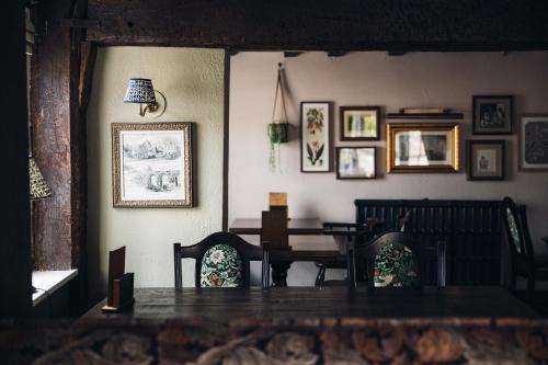 a dining room with a table and chairs at Gaskell Arms in Much Wenlock