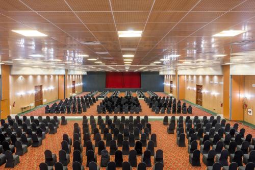 an empty lecture hall with chairs and a stage at Pickalbatros Hôtel Du Golf - Adults Friendly 16 Years Plus- All-Inclusive in Marrakech