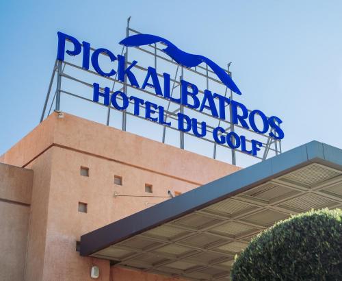 a large blue sign on top of a building at Pickalbatros Hôtel Du Golf - Adults Friendly 16 Years Plus- All-Inclusive in Marrakech