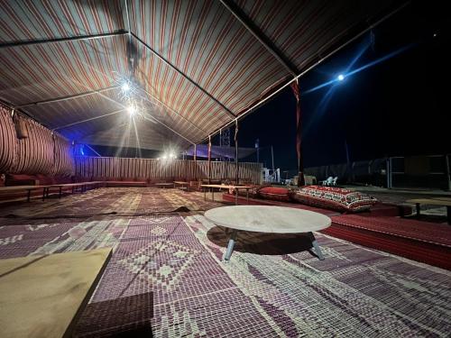 a large tent with a table in the middle at Princess of the Dead Sea Crown Group Collection in Neve Zohar
