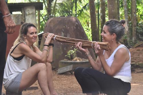 two women are sitting next to each other at AHAS GAWWA Boutique in Padukka