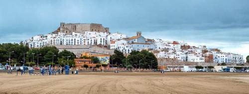 a large white building on top of a hill at Hostal Susi in Peñíscola