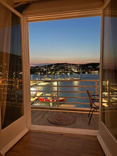 a view of the water from a window at Isalos Stay Andros in Batsi