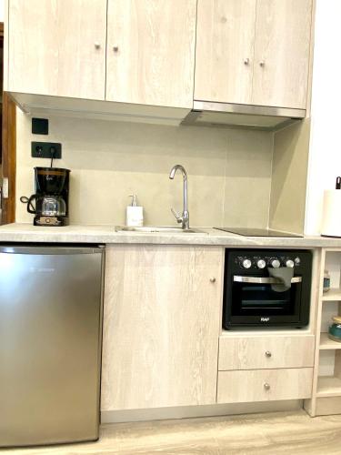 Η κουζίνα ή μικρή κουζίνα στο Mika Apt Very comfortable near City & beach