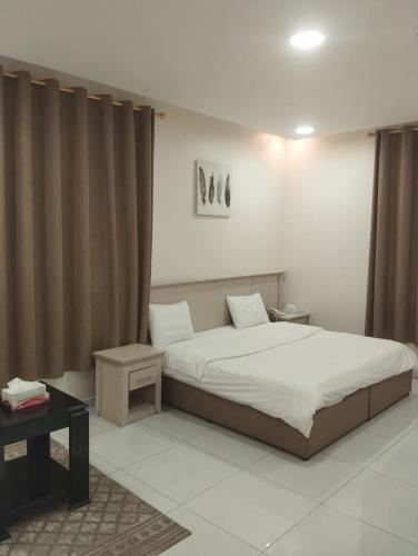 Giường trong phòng chung tại قمة الفخامة 2 للشقق المخدومة