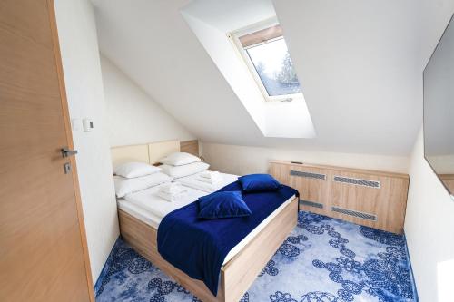 Postel nebo postele na pokoji v ubytování Hotel Zacisze
