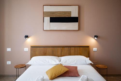 Ένα ή περισσότερα κρεβάτια σε δωμάτιο στο Il Torrino Guest House