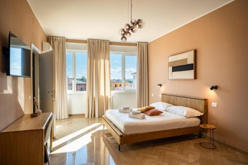 Ένα ή περισσότερα κρεβάτια σε δωμάτιο στο Il Torrino Guest House