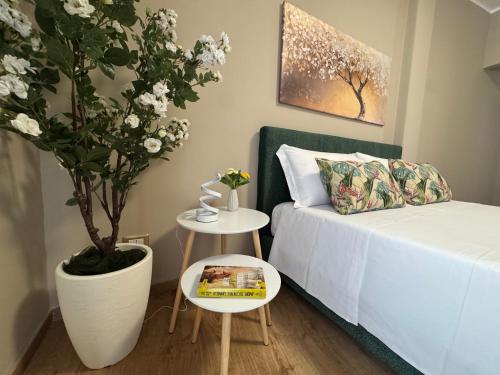 Postel nebo postele na pokoji v ubytování Palme Suites