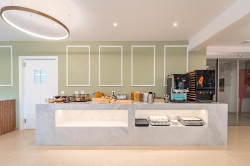 a kitchen with a counter and a counter top at Philia Center Suites in Rhodes Town