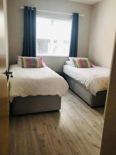 Postel nebo postele na pokoji v ubytování Apt 1, Whiterocks Portrush